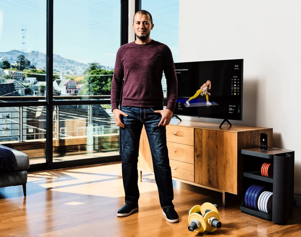 A shot of Moawia Eldeeb, co-founder and CEO of Tempo in front of the at-home fitness equipment.