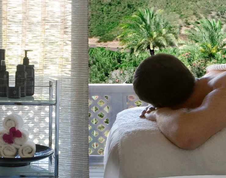 a man on a massage table in Antigua