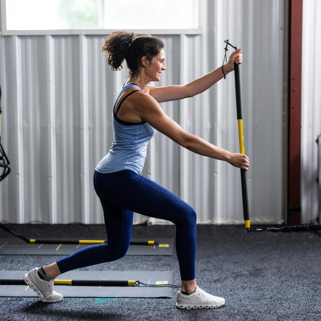 woman works out with TRX rip trainer