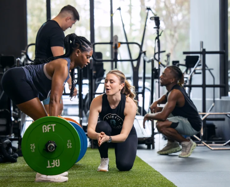 woman deadlifts at a BFT studio