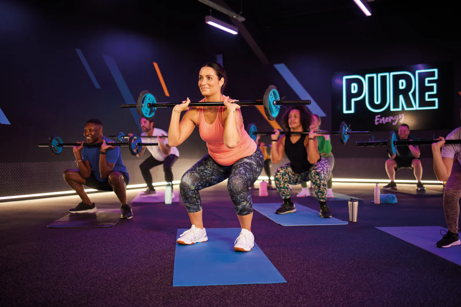 An image depicting a group fitness workout at PureGym.