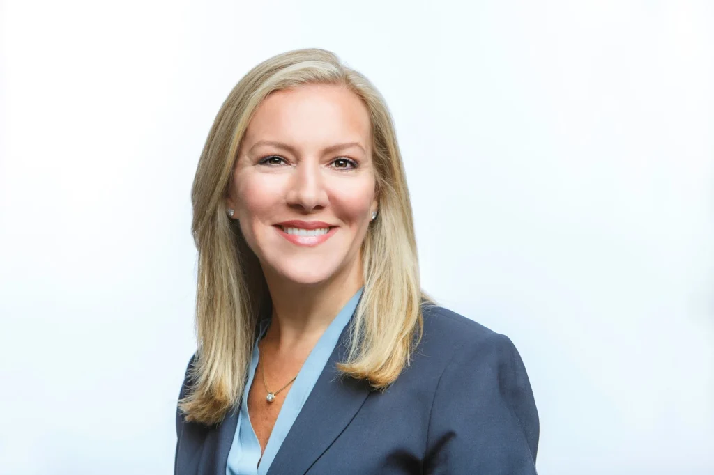 a smiling headshot of new Planet Fitness CEO Colleen Keating
