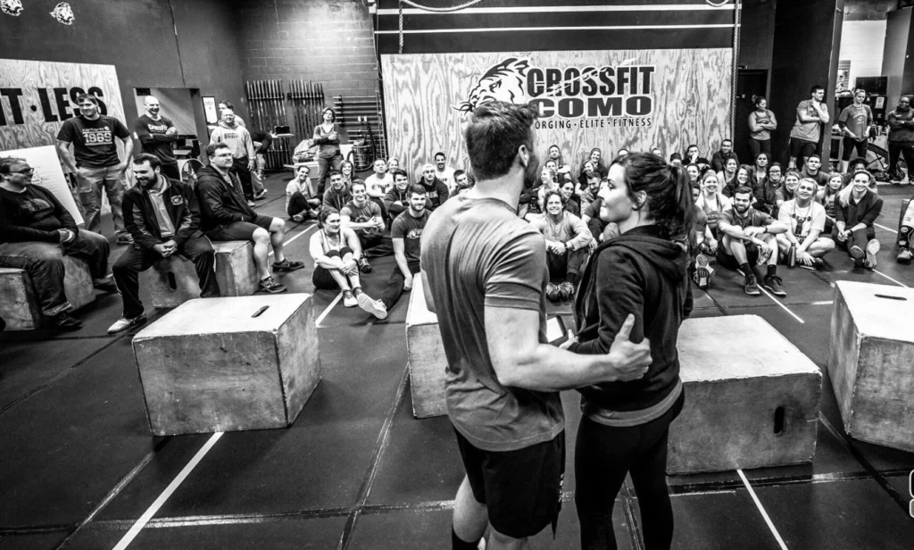 people gather inside a CrossFit studio