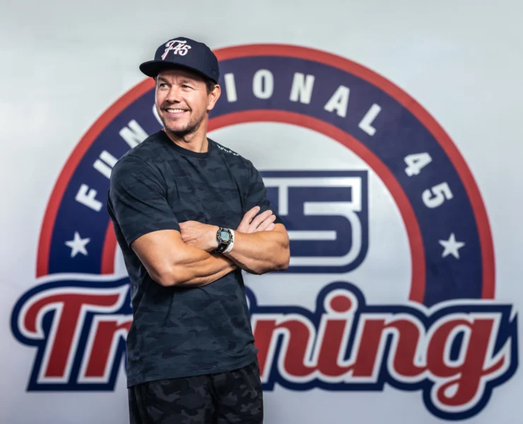 an image of Mark Walhberg in front of the F45 logo