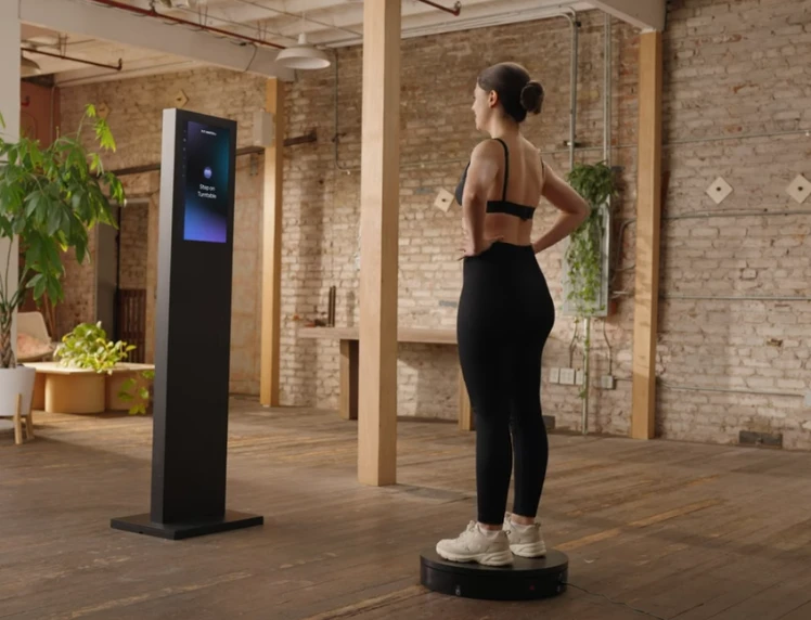 Woman using body scanning equipment