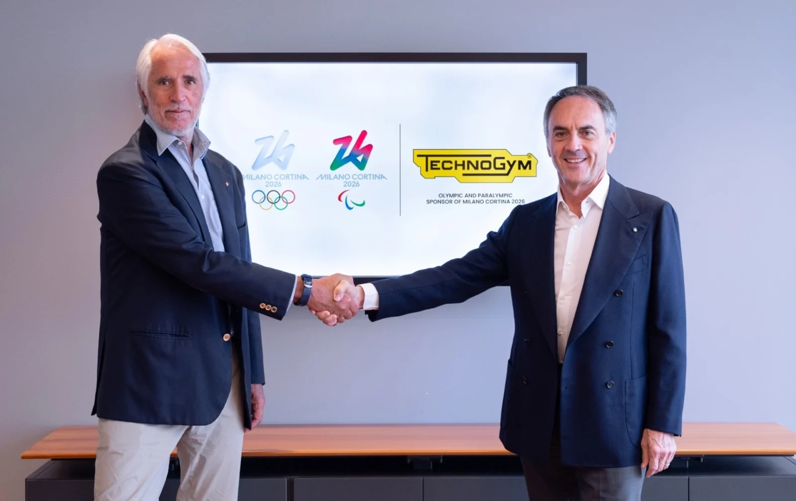 Giovanni Malagò and Nerio Alessandri shake hands to celebrate Olympic agreement