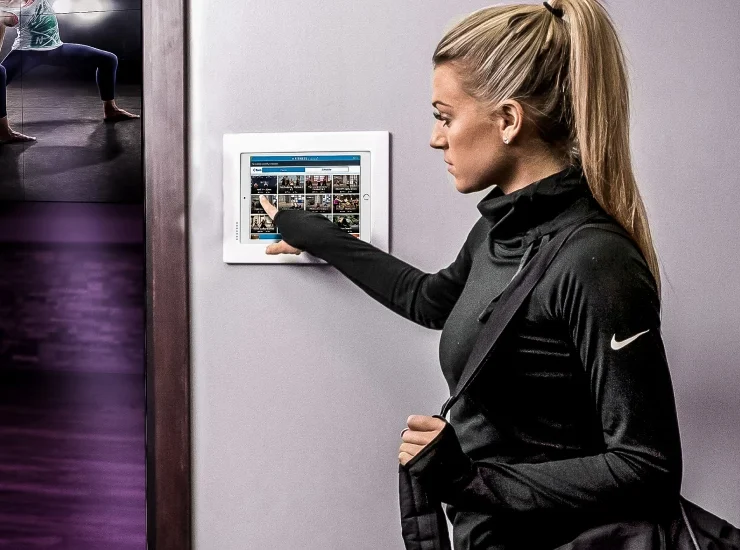 Woman signing into a group fitness class