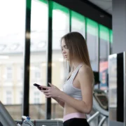 Young woman on treadmill at gym