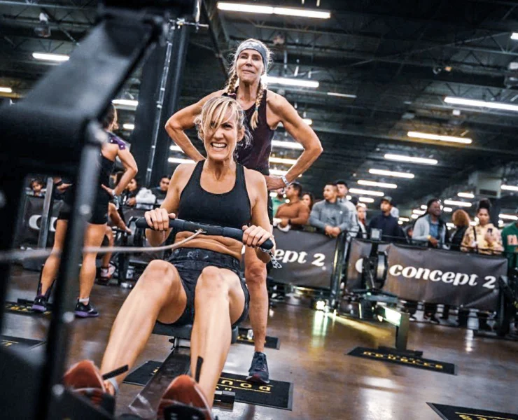 woman rows during a Hyrox event