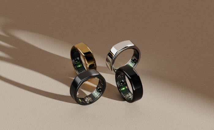 An image depicting four Oura smart rings in different colors.