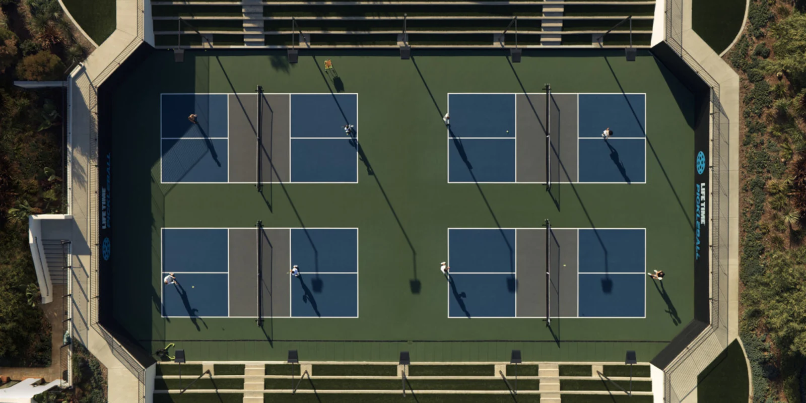 an aerial shot of Life Time pickleball courts