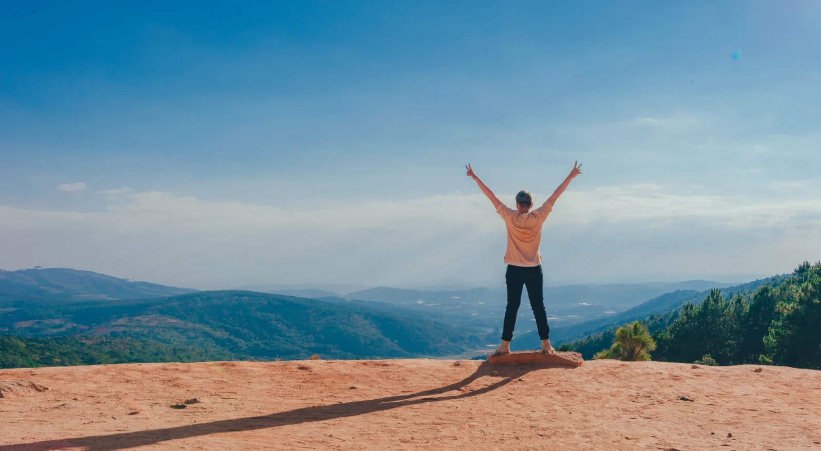 Person outside with happy arms