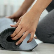 woman with a yoga mat