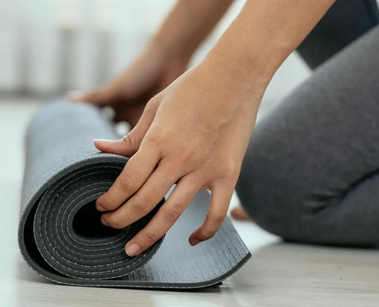 woman with a yoga mat