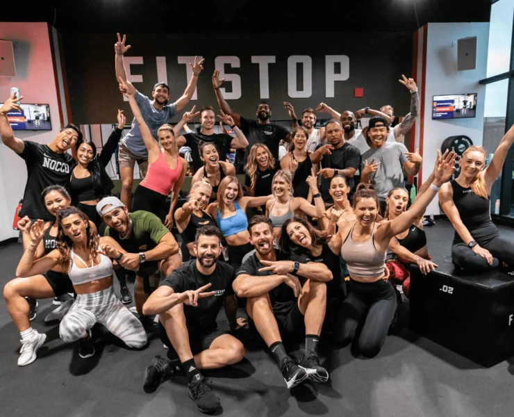 a group of smiling fitness members from Fitstop, a functional fitness franchise