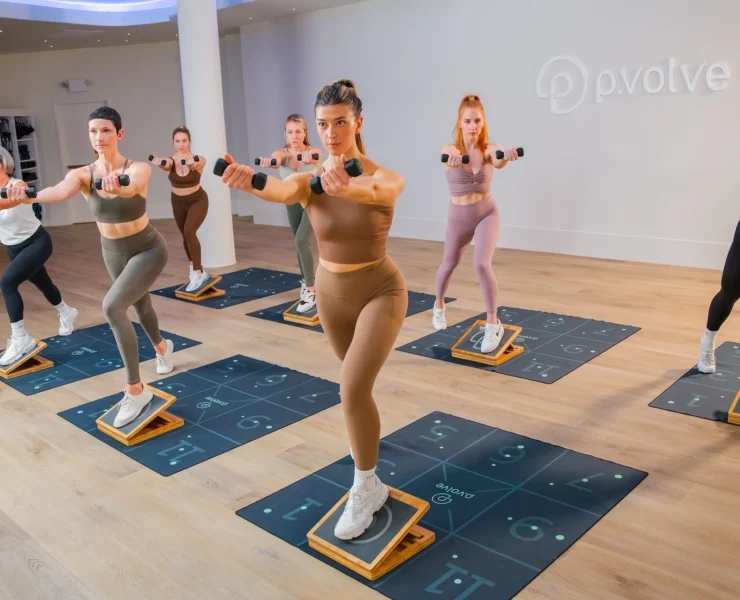 woman work out on mats at Pvolve studio