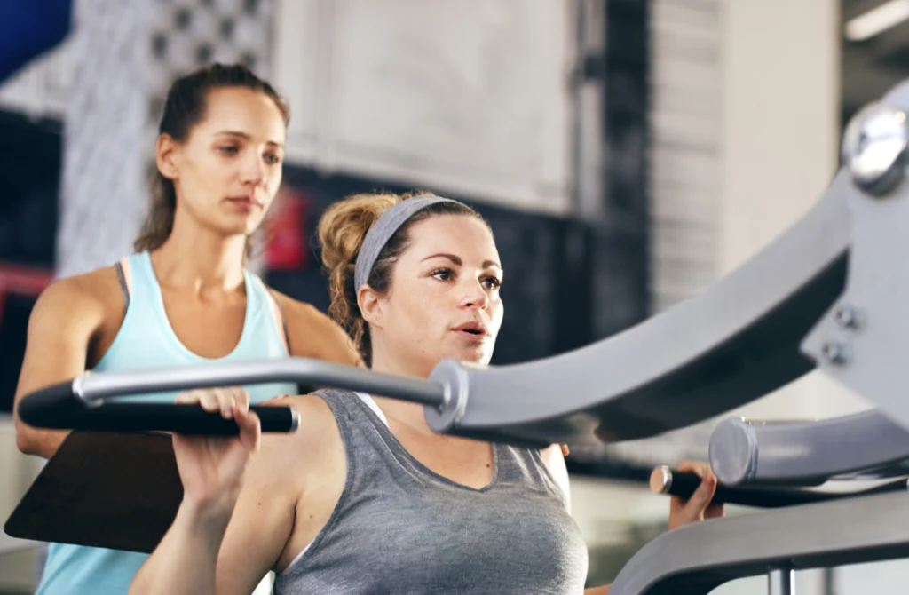 woman works out on exercise machine