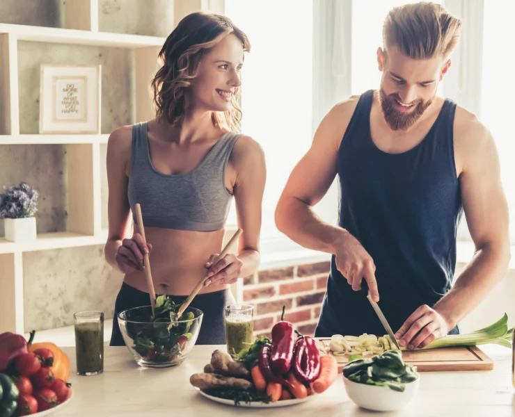 man and woman prepapre healthy food in the kitchen