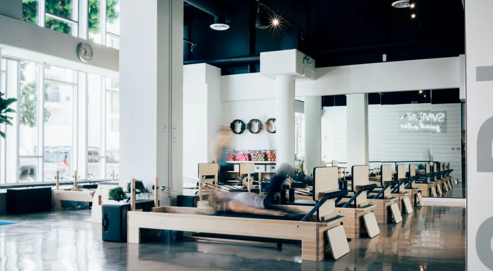 Woman on a Pilates reformer in a studio