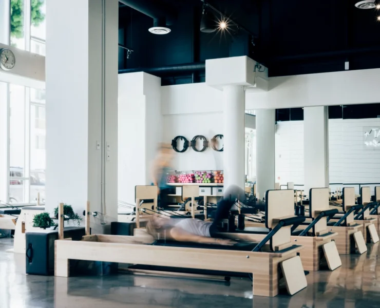 Woman on a Pilates reformer in a studio