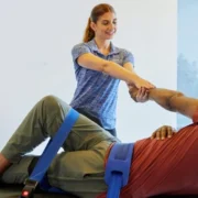 Woman Stretching man at Stretch Zone