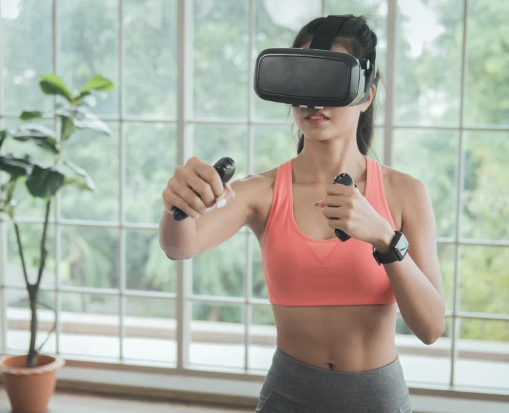 woman works out wearing a virtual reality headband